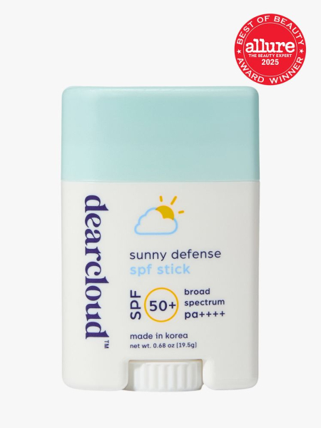 Dearcloud Sunny Defense SPF Stick in branded white twist up applicator with sky blue cap on light gray background with red Allure Best of Beauty seal in the top right corner