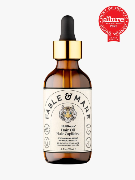 Fable & Mane HoliRoots Hair Oil in branded amber bottle with gold and black pipette on light gray background with red Allure Best of Beauty seal in the top right corner