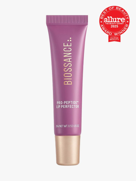 Biossance Pro-Peptide Lip Perfector berry tube of lip balm with gold cap on light gray background with red Allure Clean Best of Beauty seal in the top right corner