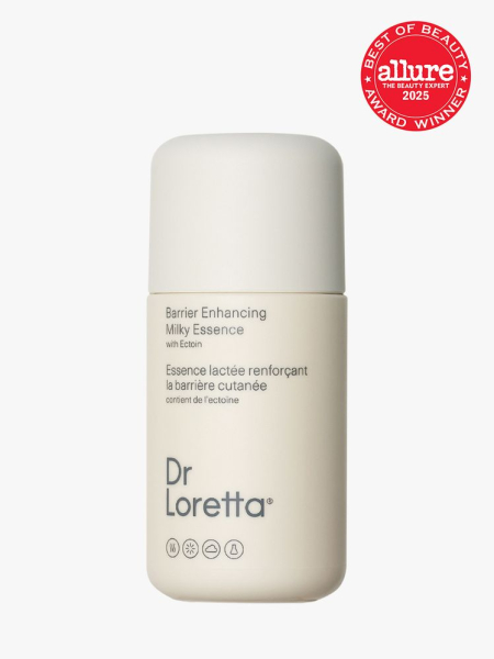 Dr. Loretta Barrier Enhancing Milky Essence in branded white bottle and cap on light gray background with red Allure Best of Beauty seal in the top right corner
