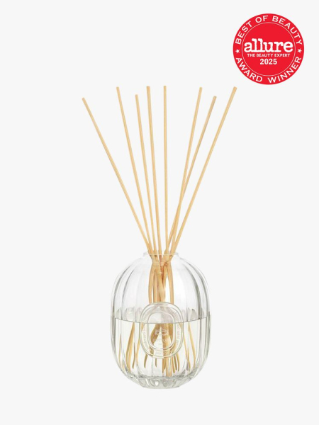 Diptyque Home Fragrance Diffuser in 2L branded clear bottle on light gray background with red Allure Best of Beauty seal in the top right corner